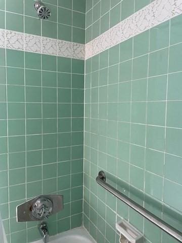 50 Wilson Dr Unit 50, Framingham, MA 01702 - bathroom featuring washtub / shower combination