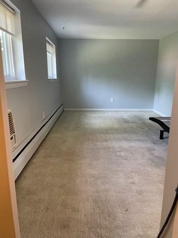 50 Wilson Dr Unit 50, Framingham, MA 01702 - spare room with baseboard heating, light carpet, and baseboards