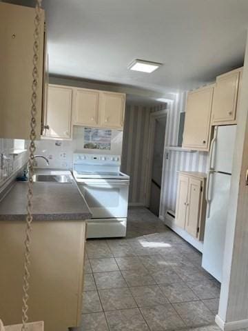 50 Wilson Dr Unit 50, Framingham, MA 01702 - kitchen featuring white appliances, a sink, and dark countertops