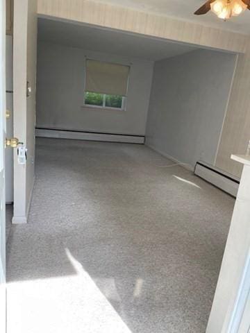 50 Wilson Dr Unit 50, Framingham, MA 01702 - unfurnished room featuring a baseboard radiator, ceiling fan, and baseboard heating