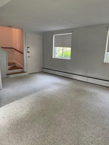 50 Wilson Dr Unit 50, Framingham, MA 01702 - spare room with a baseboard radiator and stairway