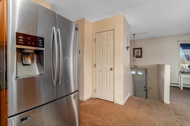 kitchen featuring baseboards, light carpet, and stainless steel fridge with ice dispenser