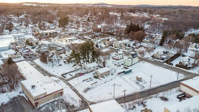 snowy aerial view featuring a residential view