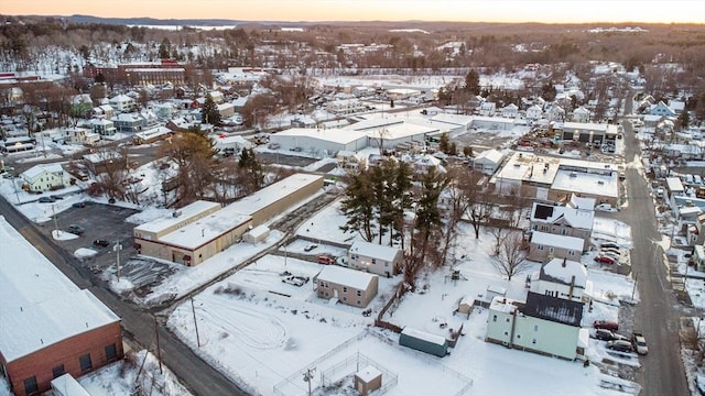 snowy aerial view featuring a residential view