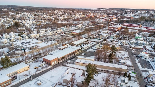 snowy aerial view featuring a residential view