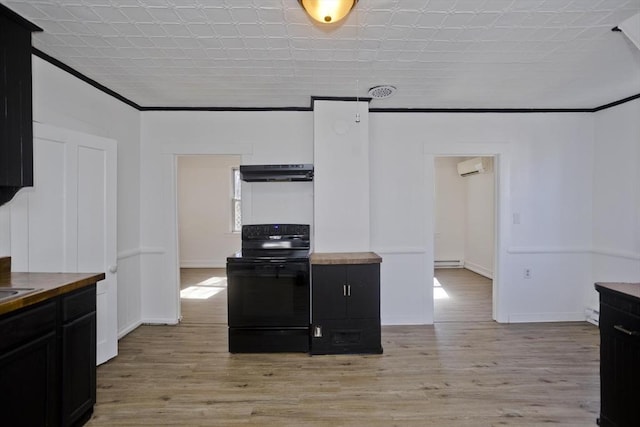 kitchen featuring light wood finished floors, black range with electric cooktop, under cabinet range hood, and butcher block countertops