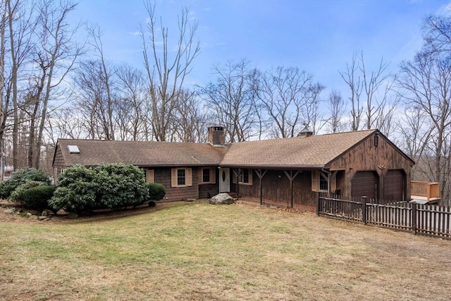 view of front facade with a garage and a front lawn