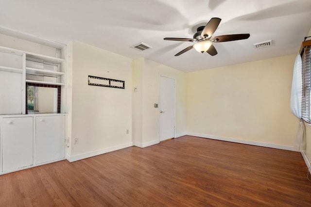 unfurnished room with ceiling fan and wood-type flooring