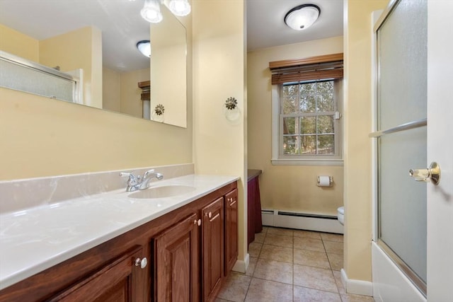 full bathroom with vanity, bath / shower combo with glass door, tile patterned flooring, toilet, and a baseboard radiator