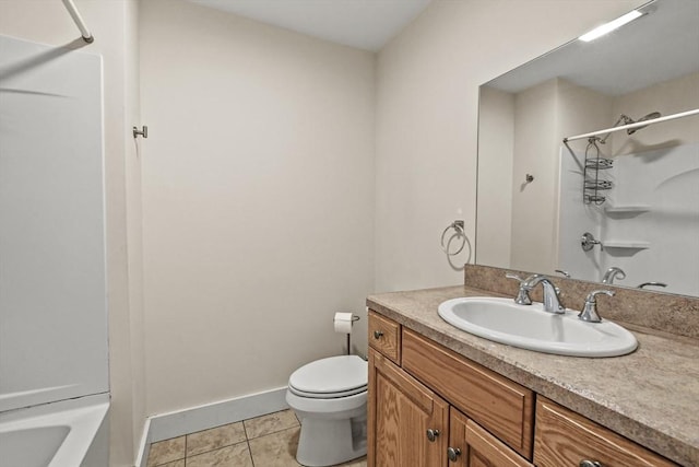 bathroom featuring baseboards, toilet, tile patterned flooring, vanity, and washtub / shower combination