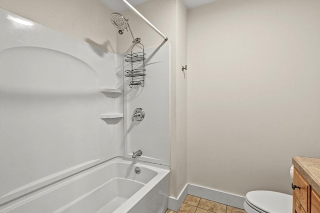 full bath with toilet, washtub / shower combination, vanity, tile patterned flooring, and baseboards