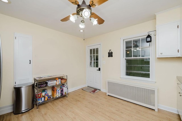 51 Jette St, Swansea, MA 02777 - interior space with radiator, ceiling fan, and light wood-type flooring