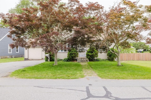 51 Jette St, Swansea, MA 02777 - view of property hidden behind natural elements featuring asphalt driveway and a garage