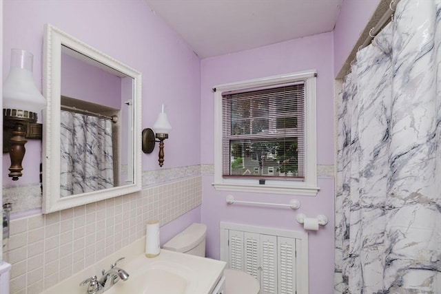 51 Jette St, Swansea, MA 02777 - full bath featuring tile walls, a shower with curtain, wainscoting, and vanity