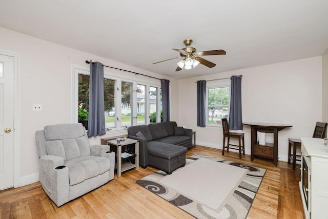 51 Jette St, Swansea, MA 02777 - living room featuring light wood-style flooring and a ceiling fan