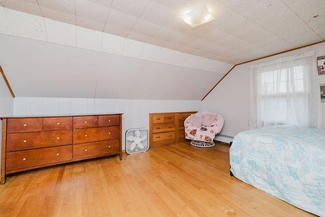 51 Jette St, Swansea, MA 02777 - bedroom with light wood finished floors, a baseboard radiator, and vaulted ceiling