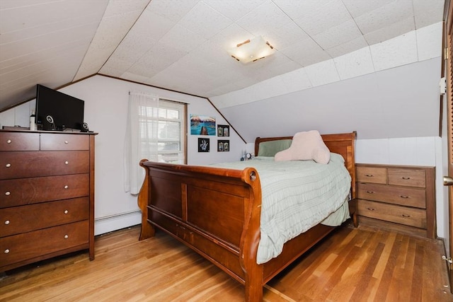 51 Jette St, Swansea, MA 02777 - bedroom with light wood finished floors, baseboard heating, and lofted ceiling