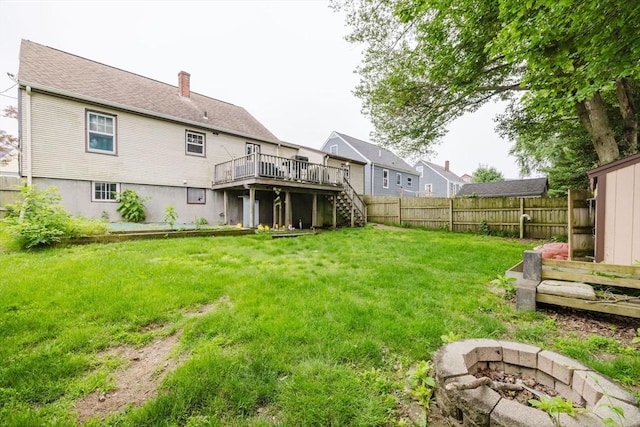 51 Jette St, Swansea, MA 02777 - back of house with stairs, a deck, a fire pit, and a chimney