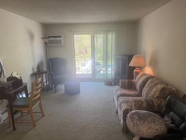 carpeted living area featuring a wall unit AC