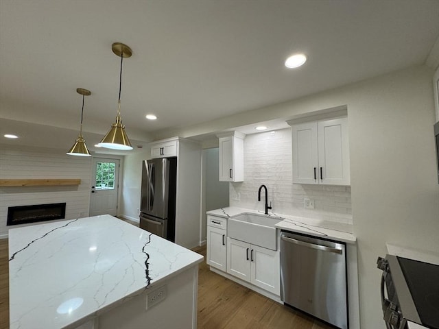 5 Mechanic St, Brookfield, MA 01506 - kitchen with stainless steel appliances, a sink, light wood finished floors, white cabinetry, and recessed lighting