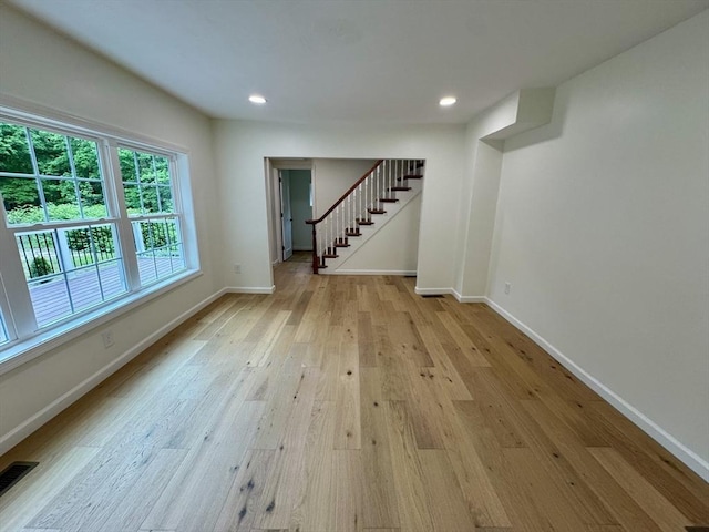 5 Mechanic St, Brookfield, MA 01506 - unfurnished living room with light wood finished floors, baseboards, stairs, and recessed lighting