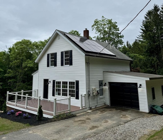 5 Mechanic St, Brookfield, MA 01506 - view of side of property featuring a chimney, roof mounted solar panels, driveway, a garage, and a shingled roof
