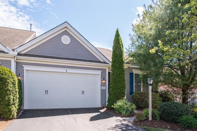 28 Picket Fence, Plymouth, MA 02360 - view of front facade featuring driveway, a shingled roof, and an attached garage