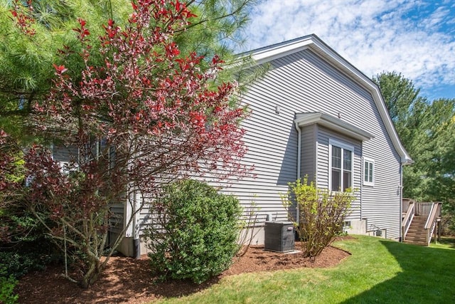 28 Picket Fence, Plymouth, MA 02360 - view of home's exterior with central air condition unit, stairs, and a lawn