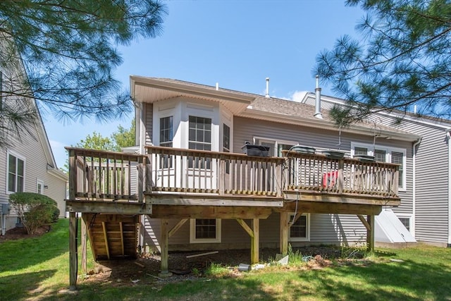 28 Picket Fence, Plymouth, MA 02360 - rear view of property featuring a wooden deck and a lawn