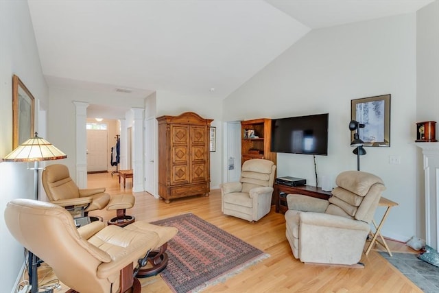 28 Picket Fence, Plymouth, MA 02360 - living area with ornate columns, light wood-type flooring, and high vaulted ceiling