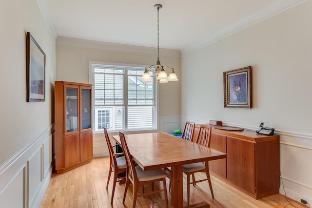 28 Picket Fence, Plymouth, MA 02360 - dining room with a decorative wall, a chandelier, crown molding, and light wood finished floors