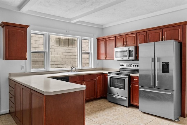 kitchen with appliances with stainless steel finishes, a sink, a peninsula, beamed ceiling, and light countertops