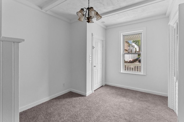 unfurnished bedroom featuring a chandelier, carpet flooring, and baseboards