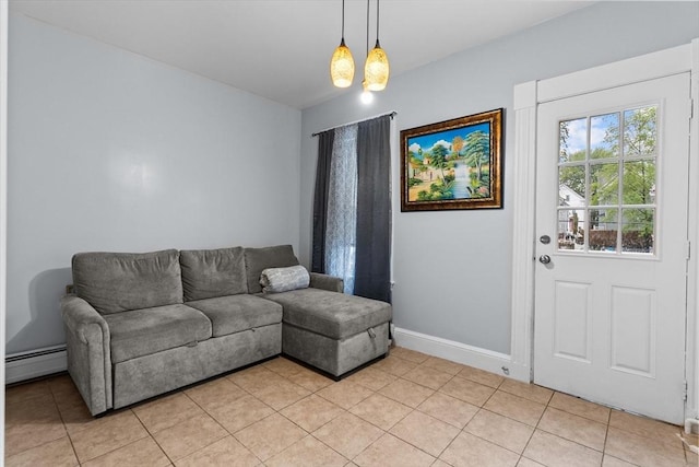 living room featuring a baseboard radiator, light tile patterned floors, and baseboards