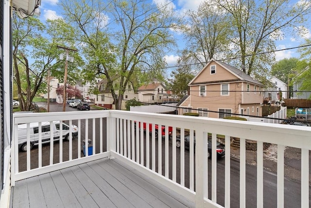 wooden terrace featuring a residential view