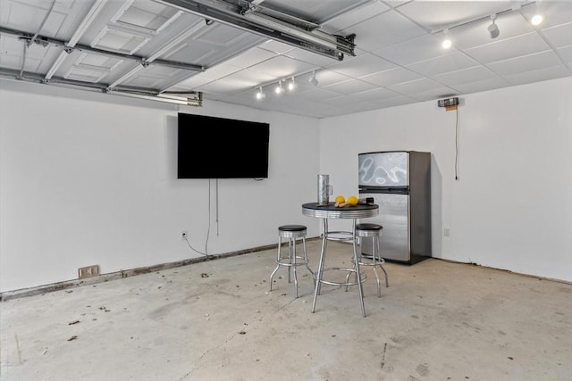 garage with freestanding refrigerator