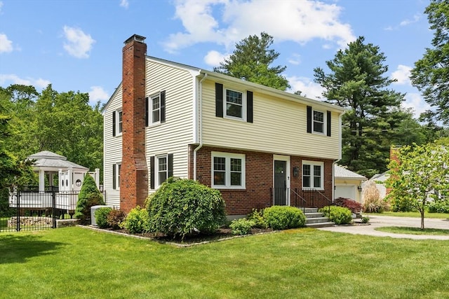 8 Knight Rd, Framingham, MA 01701 - colonial inspired home with a chimney, brick siding, and a garage
