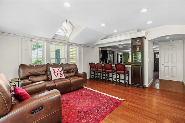 8 Knight Rd, Framingham, MA 01701 - living room with arched walkways, wood finished floors, recessed lighting, lofted ceiling, and ornamental molding
