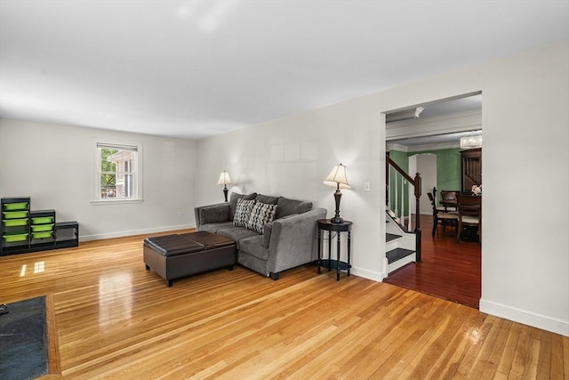 8 Knight Rd, Framingham, MA 01701 - living room with light wood finished floors, stairs, and baseboards