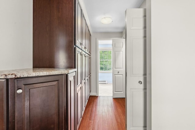 8 Knight Rd, Framingham, MA 01701 - hallway with dark wood-style floors and a baseboard heating unit