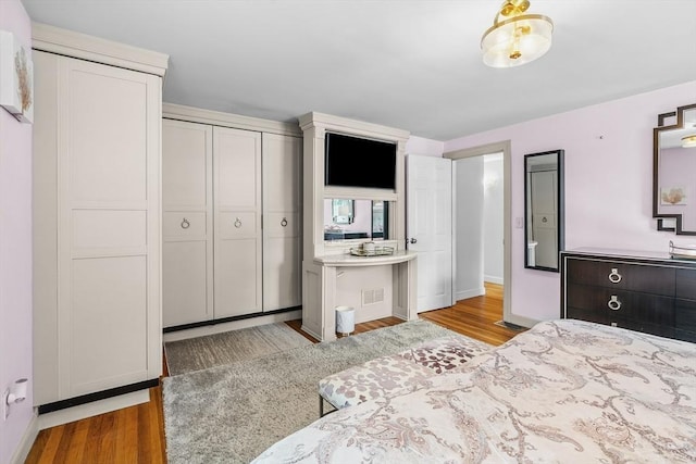 8 Knight Rd, Framingham, MA 01701 - bedroom featuring wood finished floors, baseboards, and a closet