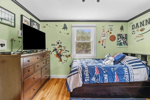 8 Knight Rd, Framingham, MA 01701 - bedroom featuring crown molding, light wood-style flooring, and baseboards