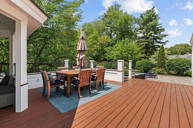 8 Knight Rd, Framingham, MA 01701 - wooden deck with outdoor dining space and view of scattered trees
