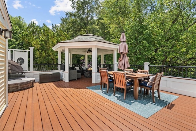 8 Knight Rd, Framingham, MA 01701 - wooden deck featuring a gazebo, an outdoor living space, outdoor dining space, ceiling fan, and view of scattered trees