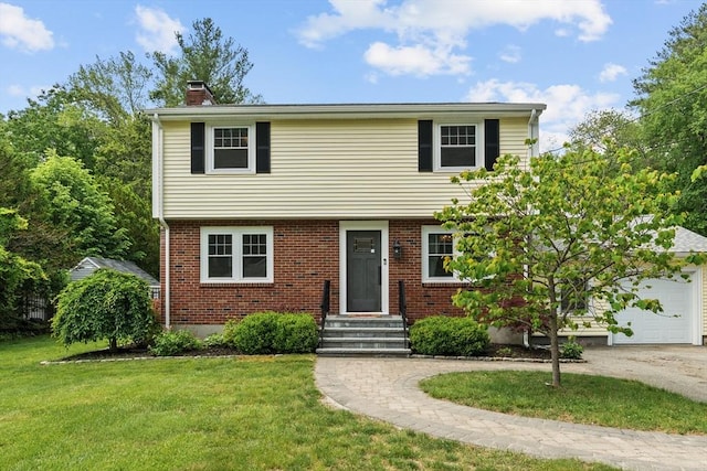 8 Knight Rd, Framingham, MA 01701 - colonial home featuring a chimney, a front yard, driveway, and brick siding