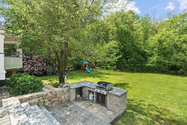 8 Knight Rd, Framingham, MA 01701 - view of green lawn featuring area for grilling, a playground, and a patio area