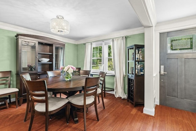 8 Knight Rd, Framingham, MA 01701 - dining room featuring plenty of natural light, ornamental molding, and wood finished floors