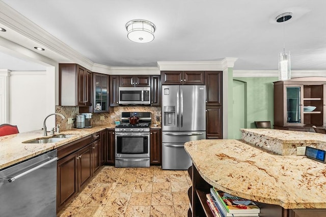 8 Knight Rd, Framingham, MA 01701 - kitchen with stainless steel appliances, a sink, backsplash, light stone counters, and dark brown cabinets