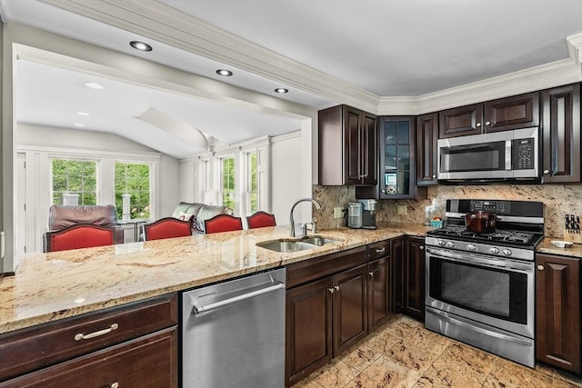 8 Knight Rd, Framingham, MA 01701 - kitchen featuring appliances with stainless steel finishes, a sink, dark brown cabinetry, light stone counters, and recessed lighting
