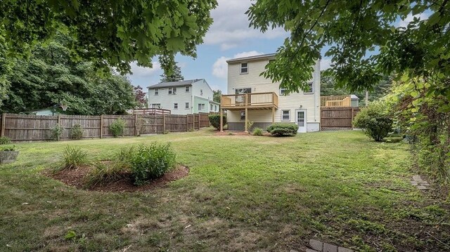 view of yard featuring a balcony